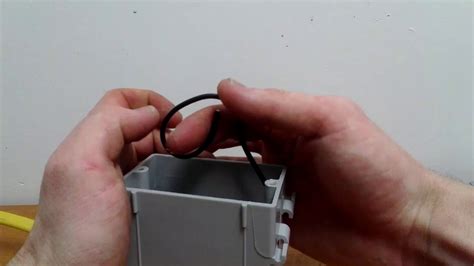 brining wires into an electrical box|folding cables into electrical box.